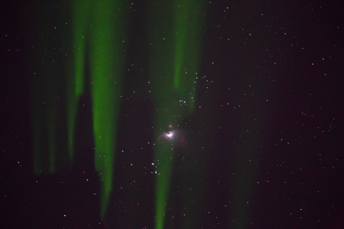 Orions nebula shot from my DSLR. The green light is from a green laser pointer