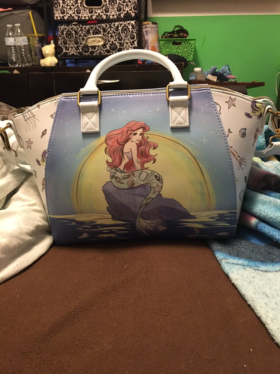 My new handbag my mother-in-law got me she knows me well I love the little mermaid