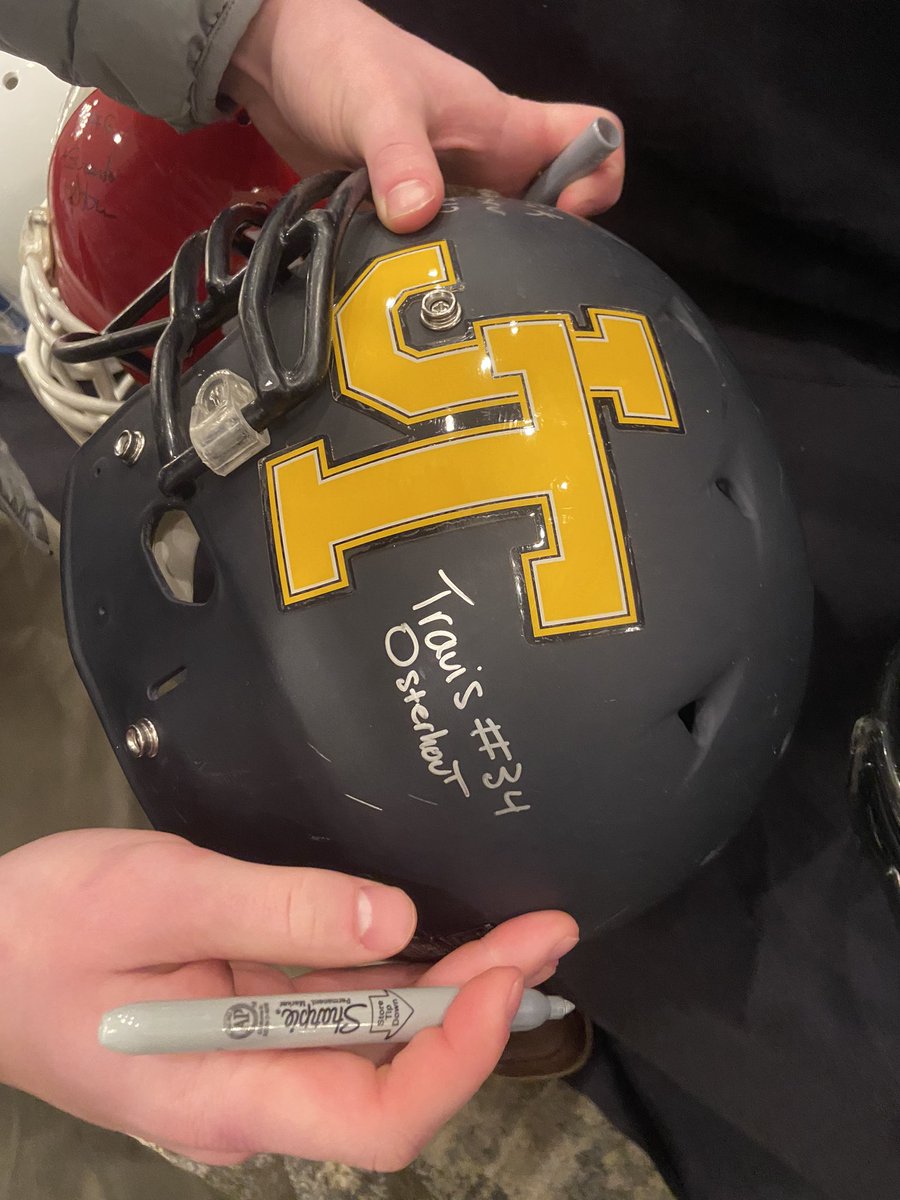 Travis Osterhout signing our helmet at the Mini Maxwell Awards dinner. Congrats Travis. Well deserved! #FalconFootball