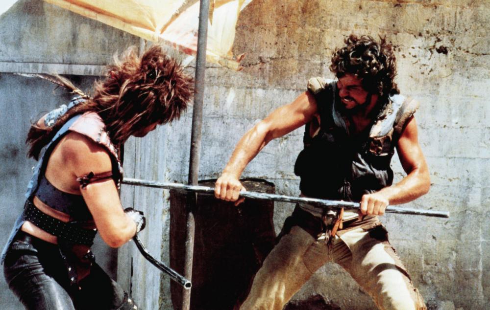 RanesHook's tweet image. This year's #NoFootballNoProblem is a true "cut" above the rest with STEEL DAWN! Wandering swordsman #PatrickSwayze isn't having "the time of his life" after the apocalypse. But he'll make damn sure to slice an' dice the opposing team in itty bitty pieces! youtube.com/watch?v=uhqY4N…