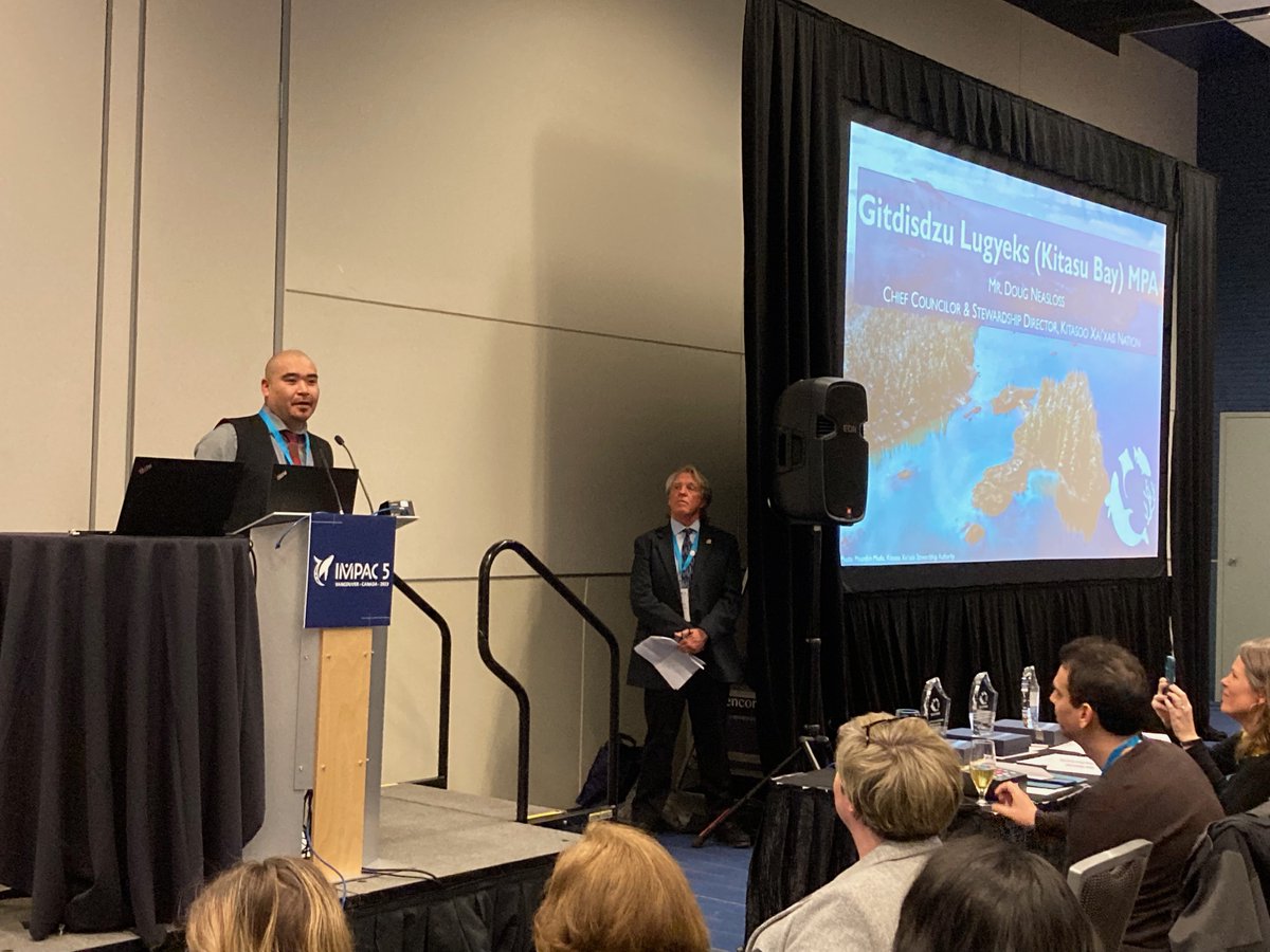 savingoceans's tweet photo. Doug Neasloss, Chief Councilor & Stewardship Director of Kitaso Xai’Xais Nation accepting the honor of Gitdisdzu Lugyks (Kitasu Bay) MPA — an indigenous-led MPA on the central British Columbia coast— being named a #BlueSpark during #IMPAC5. https://t.co/cl72pDIYXn