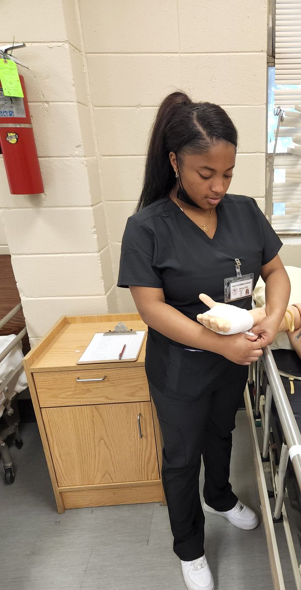 HealthMasd's tweet image. Health Science students practicing on their wrapping skills