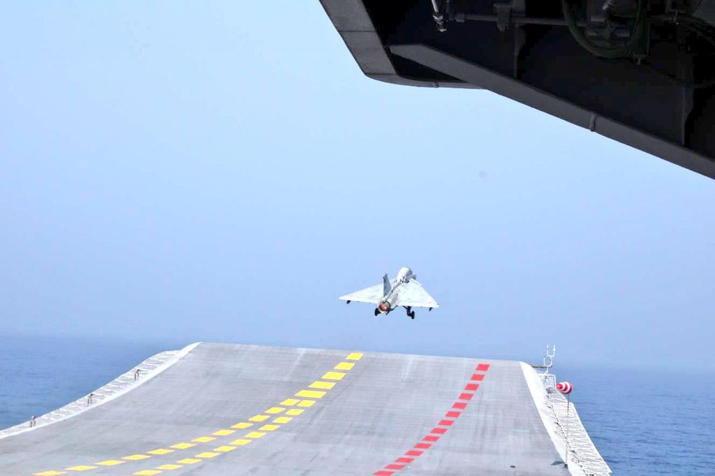 livefist's tweet photo. BREAKING: An LCA Navy has just made its maiden landing and take-off from aircraft carrier INS Vikrant. First photos: https://t.co/363KTOg6YW