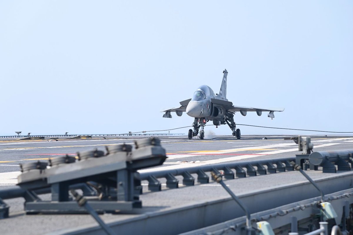 zone5aviation's tweet photo. Another historic first!

LCA NP-2 traps aboard @indiannavy's INS Vikrant, the first aircraft to be recovered by the indigenous aircraft carrier as part of its post-commissioning workup. The jet was flown by Capt Shivnath 'DAX' Dahiya, CO of the Naval Flight Test Sqn (INAS 552). https://t.co/vHkqf19u4r
