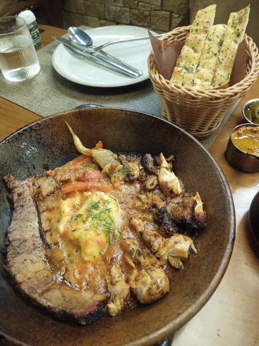 Late lunch at a Tex-Med (Texas-Mediterranean) restaurant. Brisket and mashed potatoes, eggplant, walnut