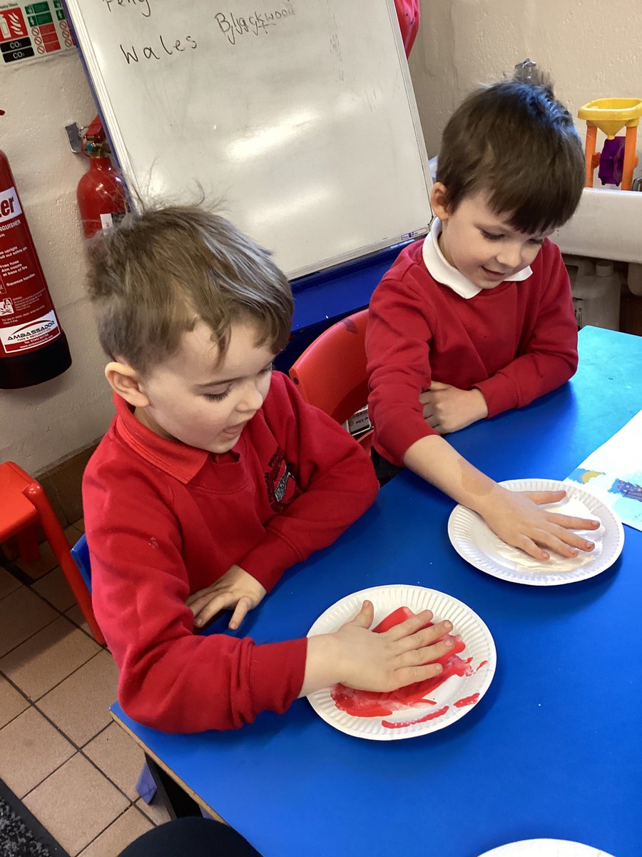 Exploring colour mixing, working together to mix the colours to make pink for our a three little pigs.
