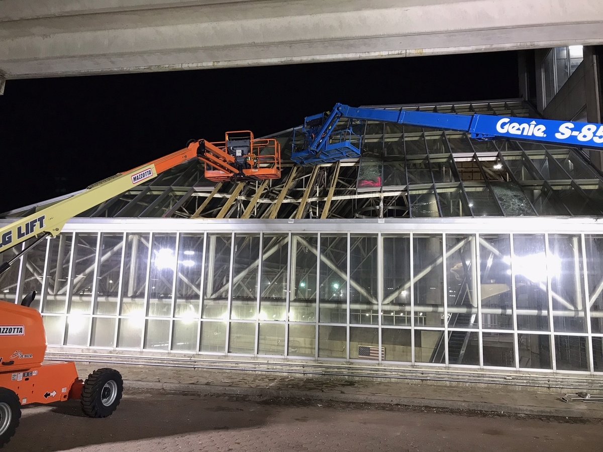 MBTA's tweet photo. Alewife Status: Station remains closed, with shuttles to Davis expected all week. We've added temporary supports to secure the roof so we can safely clear debris in the lobby &amp; inspect the structure. Plans to open Russell Field headhouse to restore Red Line service are underway. https://t.co/LeX38jyeEM