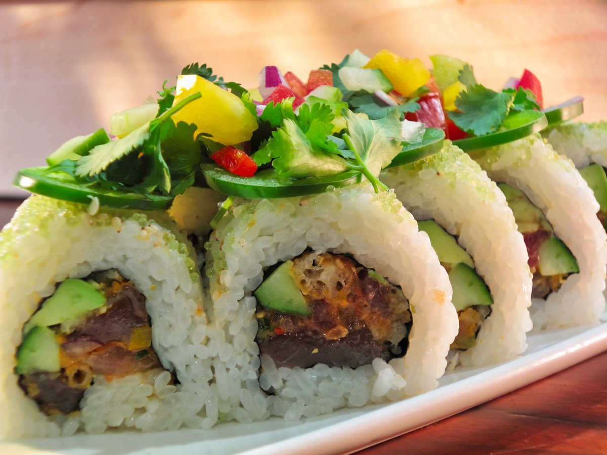 Set off some sparks with our spicy Firecracker Roll at <a href="/SushiDenDenver/">Sushi Den Denver</a>. Spicy tuna inside with crunchy tempura flakes and topped with wasabi tobiko and fresh, sliced jalapeños and chopped vegetables.  #sushi #spicy sushiden.net