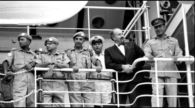 Pakpeace_UN's tweet photo. @UNPeacekeeping #UNPhoto, Brigadier-General Said-Uddin Khan (right), Commander-in-Chief of the UN Security Force #UNSF George J. Janecek & Pakistani Officers are viewing, from the bridge of a ship, the departure of 100+ Pakistani soldiers serving @UN Security Force in West New Guinea. 1 May 1963 https://t.co/RJc8sMeWVA