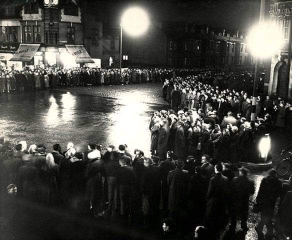 65 Years Ago Today:

Close to midnight crowds waited in the rain for the cortege of coffins of the victims of the Munich Air Disaster to pass.

#FlowersOfManchester