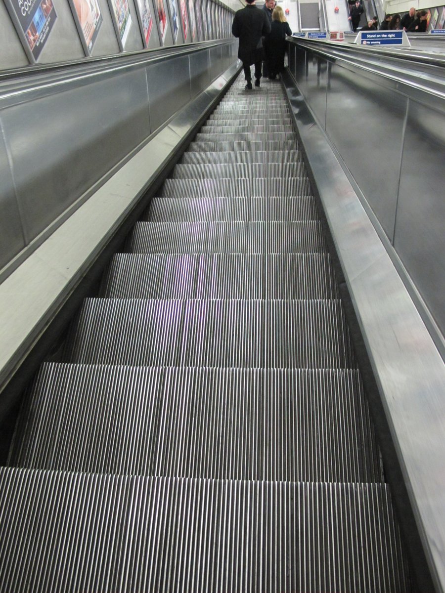 SandraDanby's tweet photo. Looking down the down escalator #TravelTuesday #London #Underground #TheTube 
#IgnoringGravity #amreading https://t.co/8eCUtCIsBW