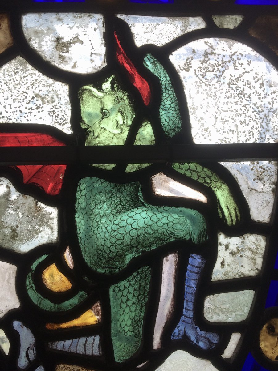 Claws, scales, talons but essentially a human form, an Imp. Clearly up to no good in Salisbury Cathedral. #stainedglass #medievalglass #salisburycathedral, #medieval #middleages #imp #purgatory #temptation #englishcathedrals #glassmakers