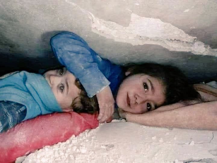 In Syria, 17 hours after the earthquake devastated the region yesterday, this 7-year-old girl was found under the rubble with her hand over her little brother's head to protect him. Both made it out safely.