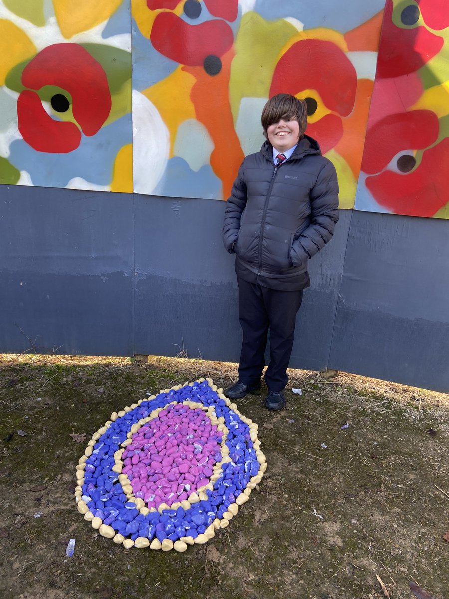 Following a short reflection, Year 10 students establish our Holocaust Memorial in the Peace Garden.