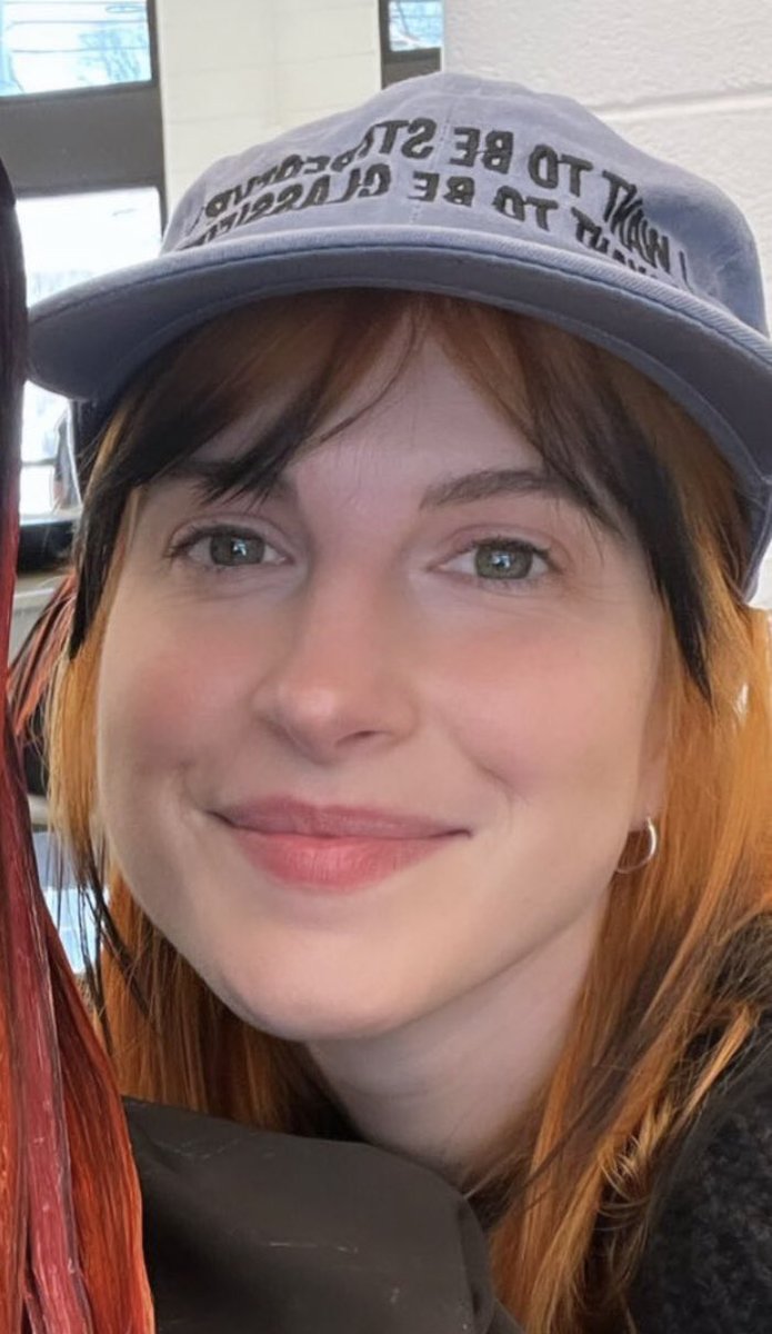 her hat says Women want me fish fear me (i can’t read backwards)