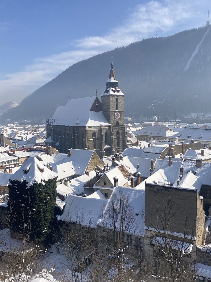 Medieval church and houses under snow #Brasov