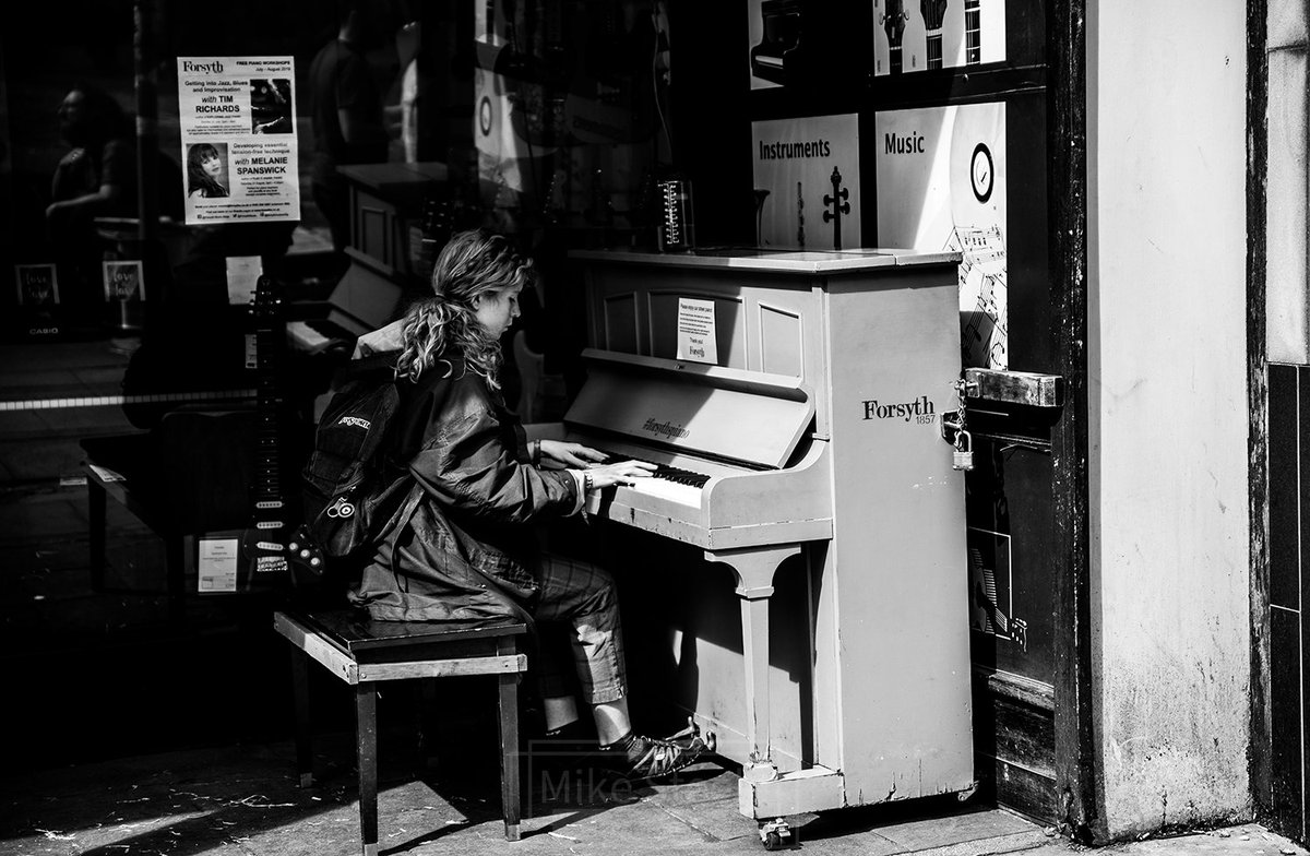 Street piano player in Manchester. #streetphotography #streetphoto #MANCHESTER #nikonphotography