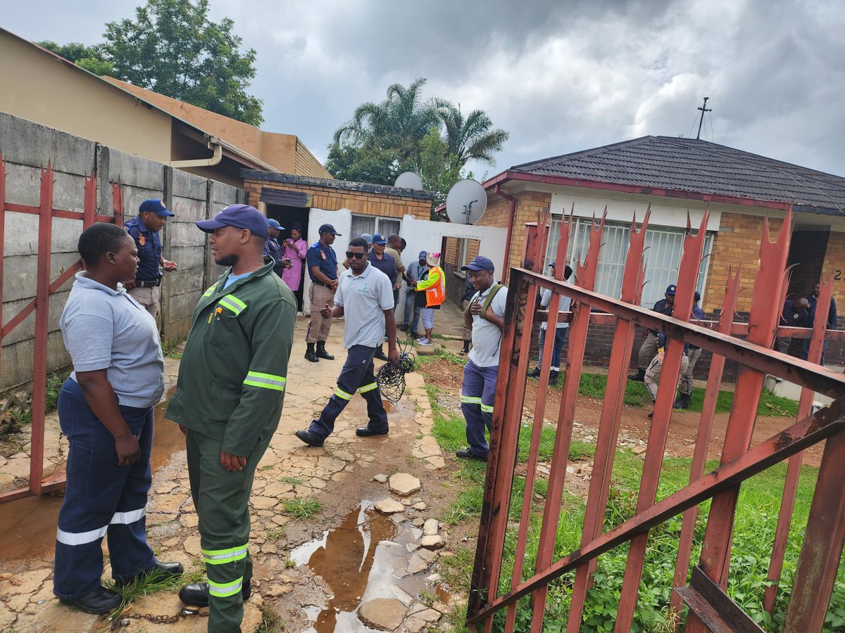 MathibaneTebogo's tweet photo. The disconnection of water and electricity at the hijacked Houses in Primrose is well underway. 
@ActionSACaucusE is resolute that criminality has no place in society. 

Joining us is the Department of Home Affairs: Immigration https://t.co/aD9zNBhjyJ