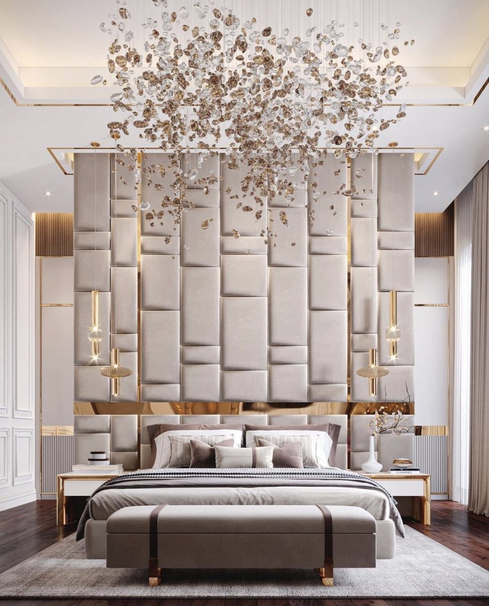 A natural palette with golden accents in this luxury bedroom .