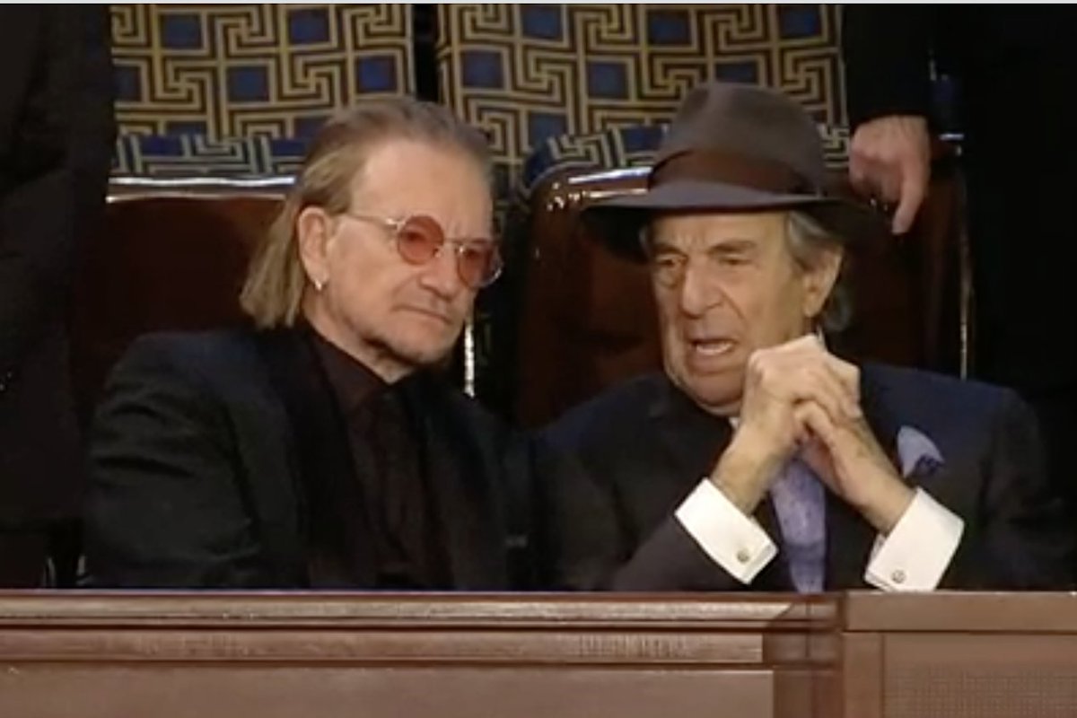 jbendery's tweet image. The state of our union right now is... Bono kicking it with Paul Pelosi.