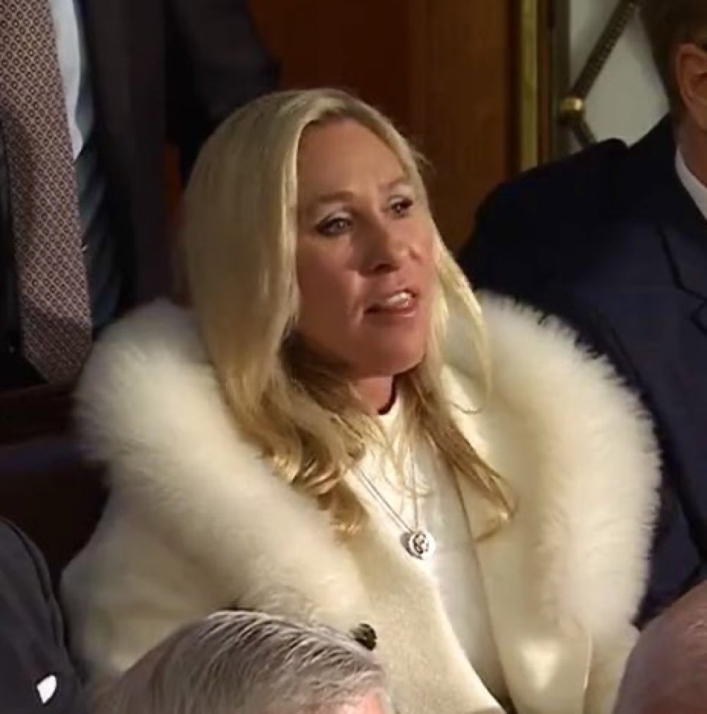 notcapnamerica's tweet photo. Why is Marjorie Taylor Greene dressed like Carmella Soprano? #SOTU https://t.co/zBnseMAUkf