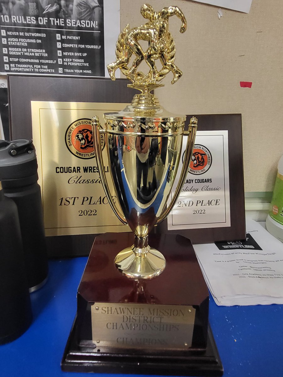 SMNWWrestling's tweet photo. The @theSMSD boys and girls Wrestling Championship Cups stay at SMNW tonight! Our Girls made history by being the 1st girls team to earn the district cup! Great job by all tonight! #everydaychampions https://t.co/C88be9a1Am