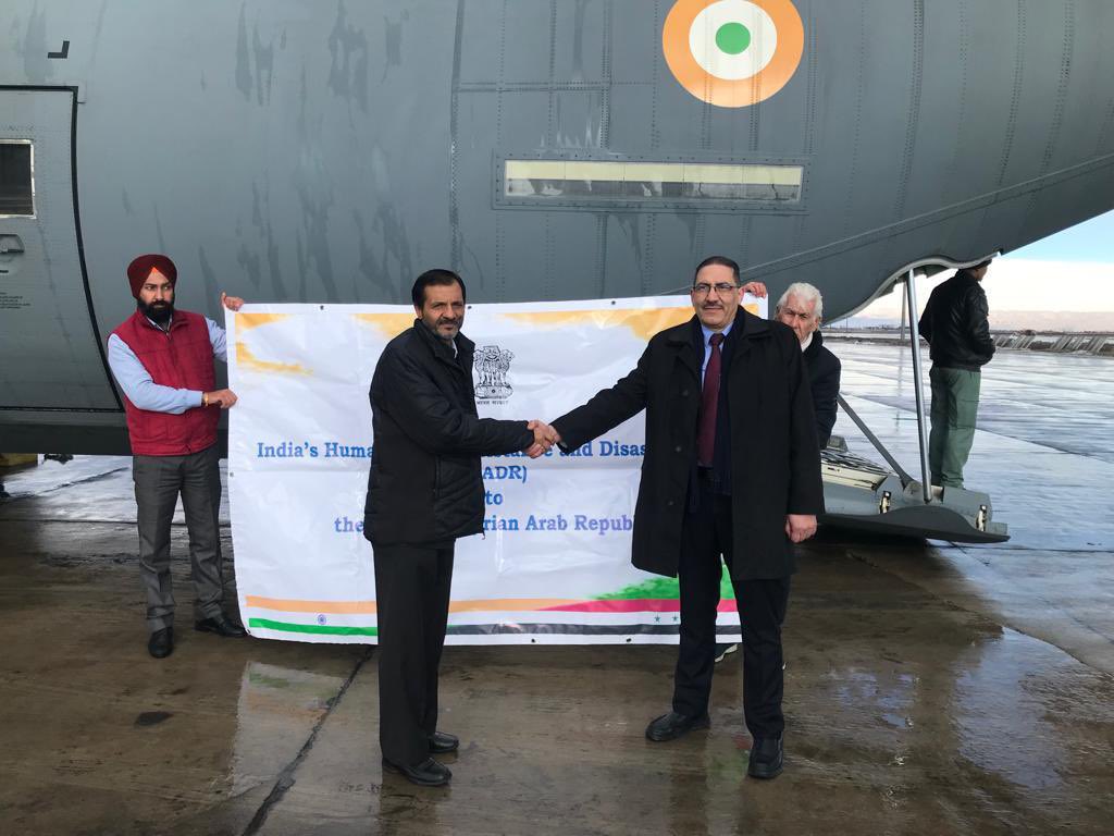 MEAIndia's tweet photo. Over 6 tons of emergency relief assistance reaches Syria. 

Received at the Damascus airport by Deputy Minister of Local Administration &amp; Environment Moutaz Douaji. 

Includes 3 truck-loads of protective gear, emergency use medicines, ECG machines and other medical items. https://t.co/B2z7du7IT2
