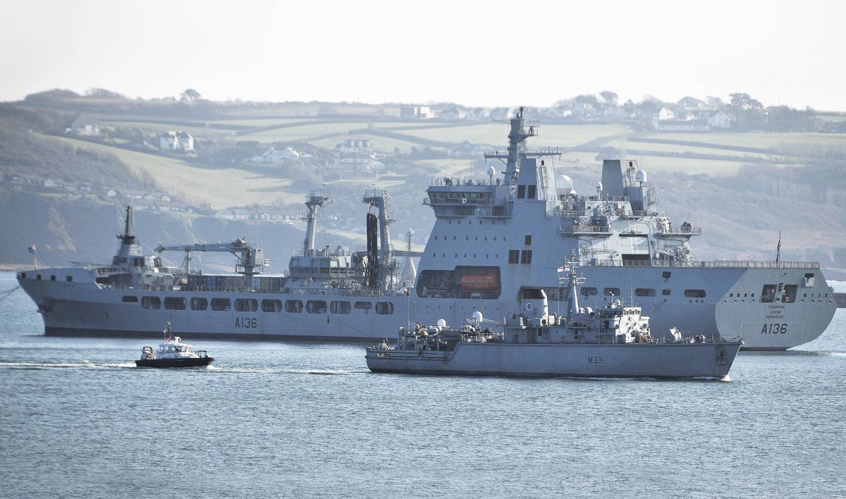 .@FOST Dauphin helicopter transferring personnel form @HMSSomerset at anchor south of Plymouth Breakwater @HmsBrocklesby outbound passing @RFATidespring Via @RfaNostalgia