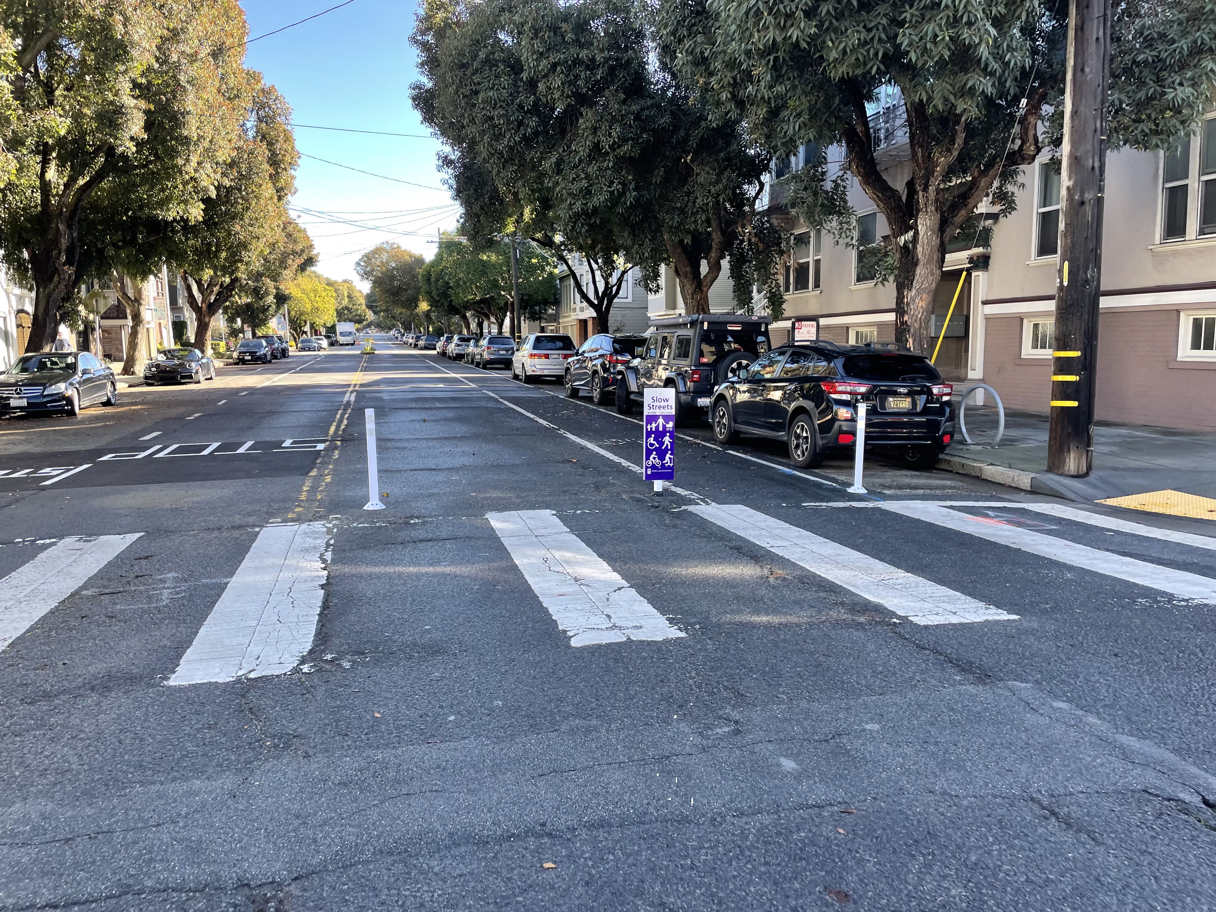 Slow Lake Street with its new sign/infrastructure, notably with a gap large enough for drivers to drive as many blocks as they want on the street without having to slow down or move at all.