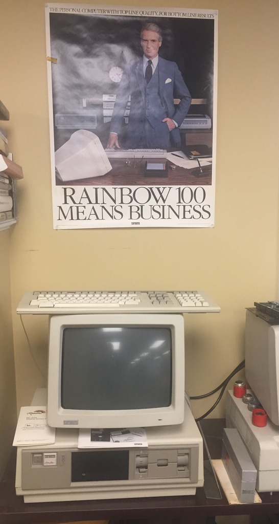 Terry Gerber, and ex-DEC employee, donated lots of DEC marketing posters from the 1980s. We put the Rainbow 100 poster above the Rainbow 100 that was donated last week.