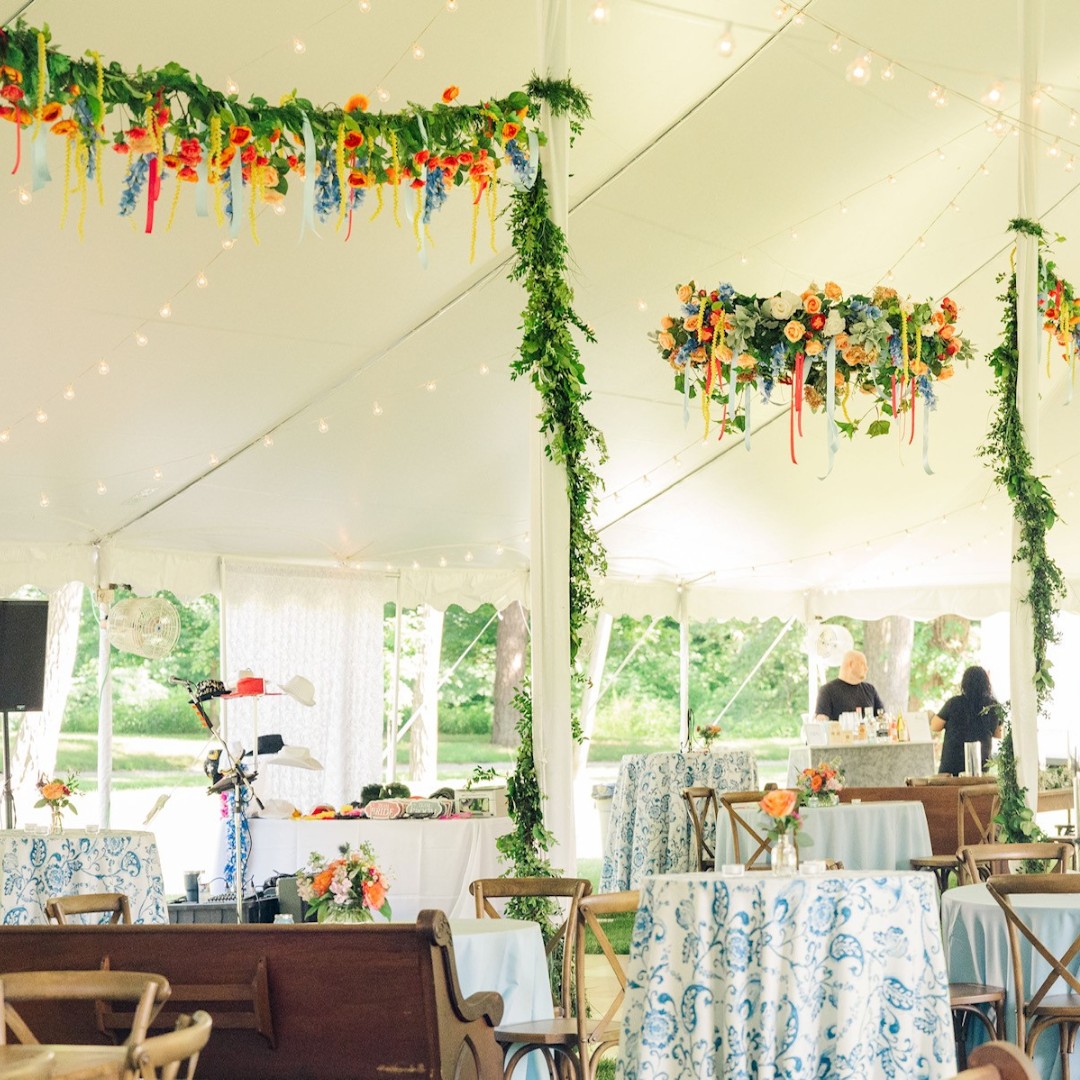 We love to see the creative ways our clients decorate their tents. Check out this 40x100 wedding tent. Just stunning!! #weddingtent #tentwedding #partytents #tentrentals #2023wedding #outdoorweddings #flowerarrangement #weddingflowers