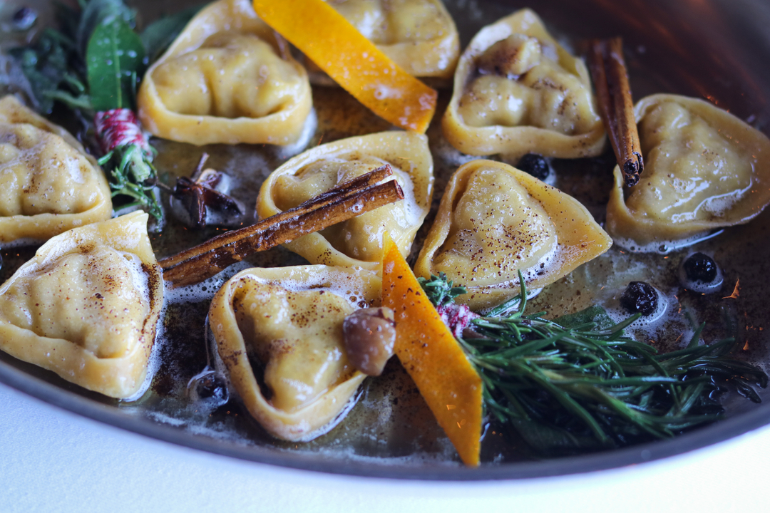 B A L A N Z O N I 

The Balanzoni con Burro Fuso Aromi Misti, stuffed with duck and chestnut, is bathed in an aromatic bath of brown butter with herbs and spices, and served tableside from the pan during our Friulano tasting menu.