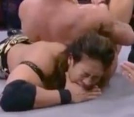 tylernoir's tweet photo. Takeshita biting his own hand to deaden the pain of the armbar: 
#AEWDynamite https://t.co/r26gDFBUHI