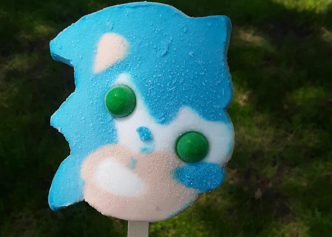 In the New Year's 2021 artwork posted by the official Sonic the Hedgehog Twitter, Dr. Eggman is selling ice cream bars of Sonic's likeness, made to resemble the real-world Blue Bunny ice cream bars that are infamous for the usually poor placement of its gumball eyes. 