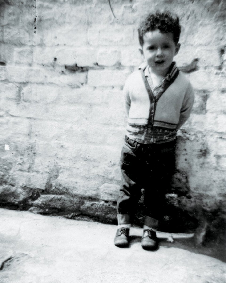 My Father took this photo of me in the backyard of 206 Rathbone Road Liverpool, opposite The Rathbone Pub. I was born close to the famous Meccano Factory in Binns Road, Liverpool 13 (my lucky number) I think he had one frame left on the roll of film and needed to use it up.