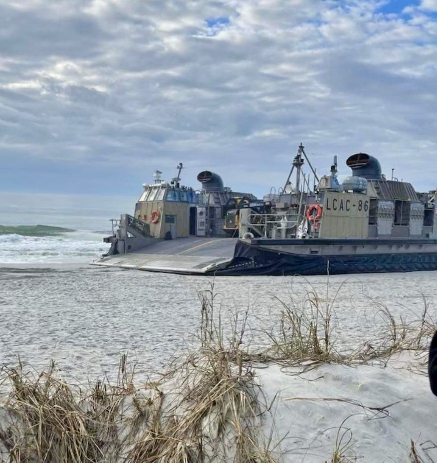 EdPiotrowski's tweet photo. Last Saturday a Chinese Spy balloon in Myrtle Beach. Today a U.S. Navy Landing Craft Air Cushion (LCAC) is sitting on Cherry Grove Beach. Trying to figure how it got there. 📸 D Angela Williams. https://t.co/BrS2pTfNZO