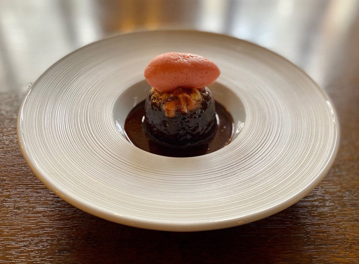Steamed chocolate pudding with blood orange sorbet, confit fruits and roasted nuts anyone??

#chocolate #pudding #dessert #bloodorange #finedining #HerbertBergeratInnholdersHall