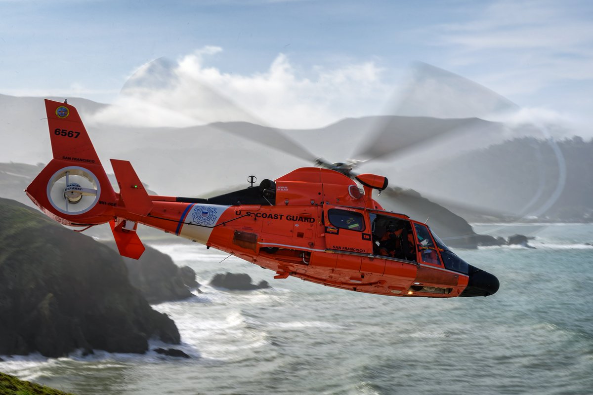 A <a href="/USCG/">U.S. Coast Guard</a> MH-65E and crew from San Francisco Air Station in California. Crews were conducting cliff hoist training near to Mori Point.