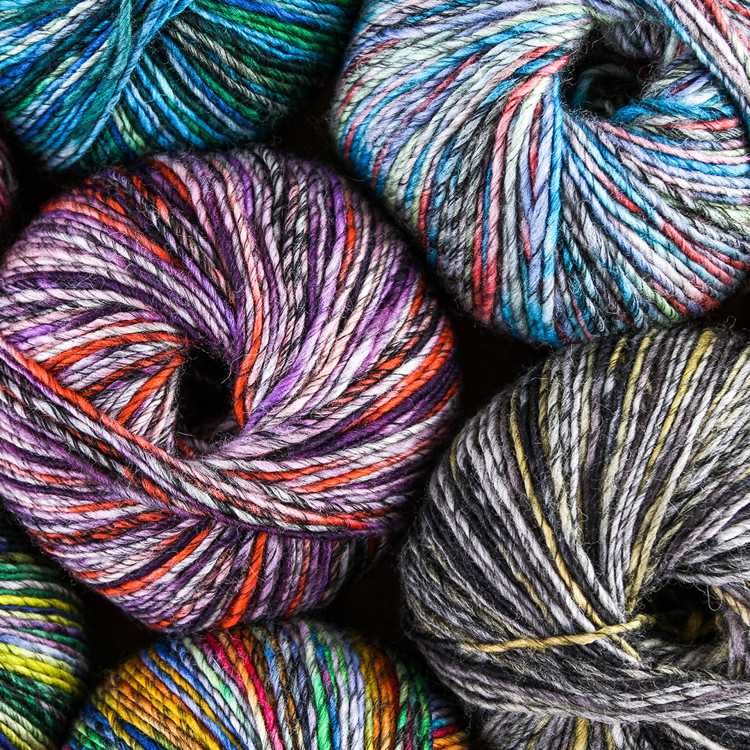 If your heart has been chilled by frigid winter temps, then Tahki Yarns Kaleidoscope will warm it right back up. This colorful, marled, superwash wool #yarn is bright, cheery, durable, AND soft. It truly checks all the boxes. #knitting #crochet