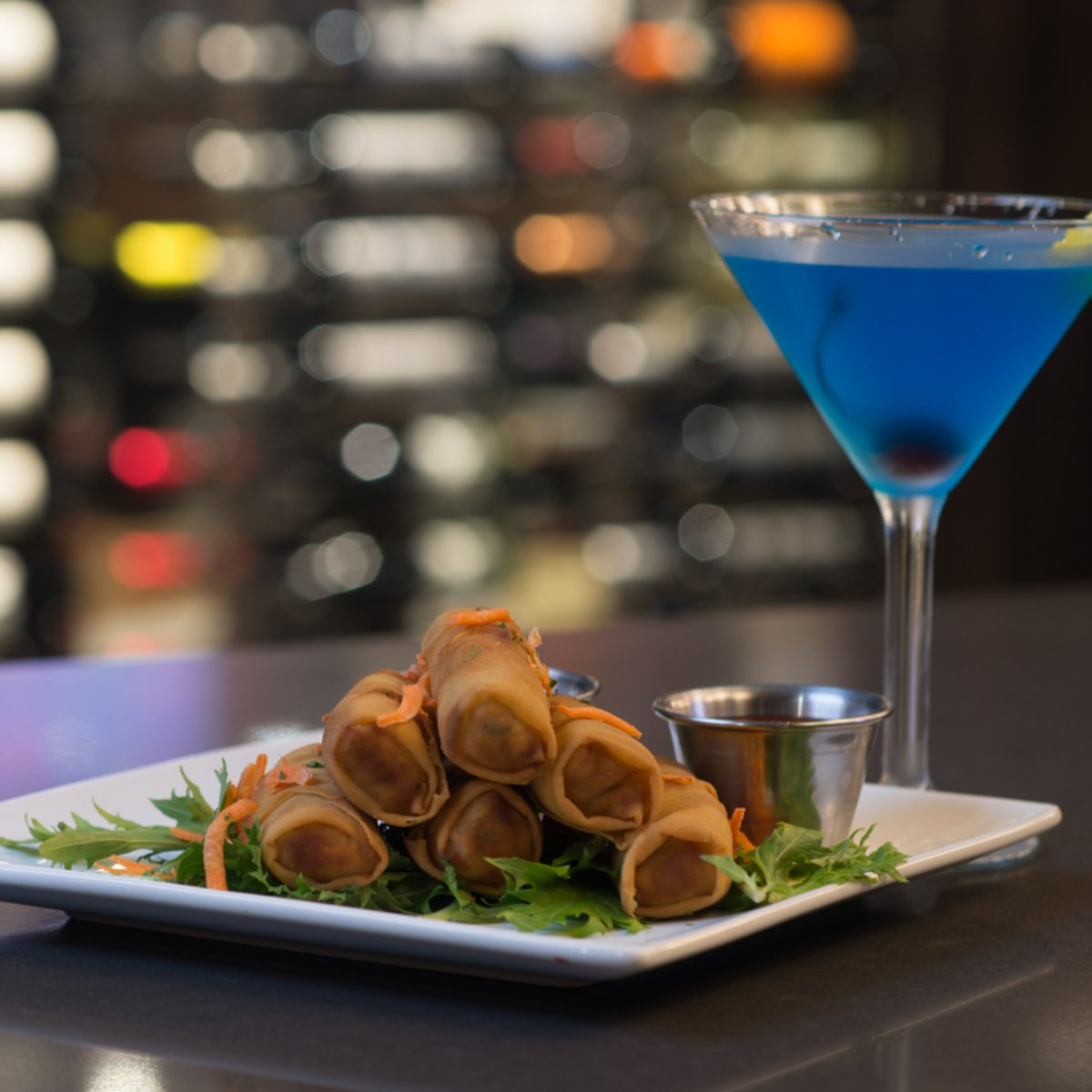 Everyone deserves to treat themselves to something delicious like an order of savory egg rolls and a refreshing cocktail.