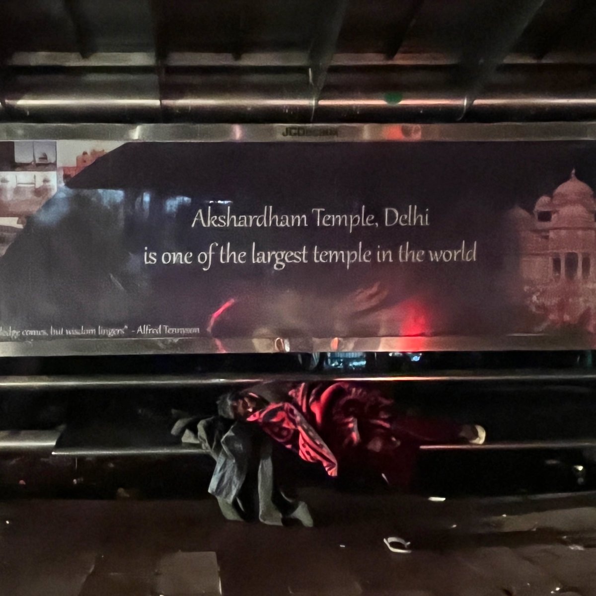 On a bench at a bus stop,
On a nameless stress,
On Winter night in Delhi
Wrapped in a shroud 
Of black and white and red and headlights!
A hoarding proclaimed - Akshardham temple Delhi ,
Is one of the largest temples in the world.

#homelessless #delhi #urbanism #worldrecords