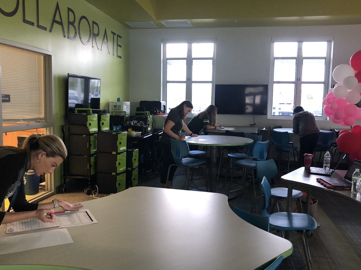 DaraTucker's tweet photo. Our first grade teachers engaged in calibrating their student writing scores and how they can move their writers at all levels in PLC. 💚💙 https://t.co/3MzNausz4s