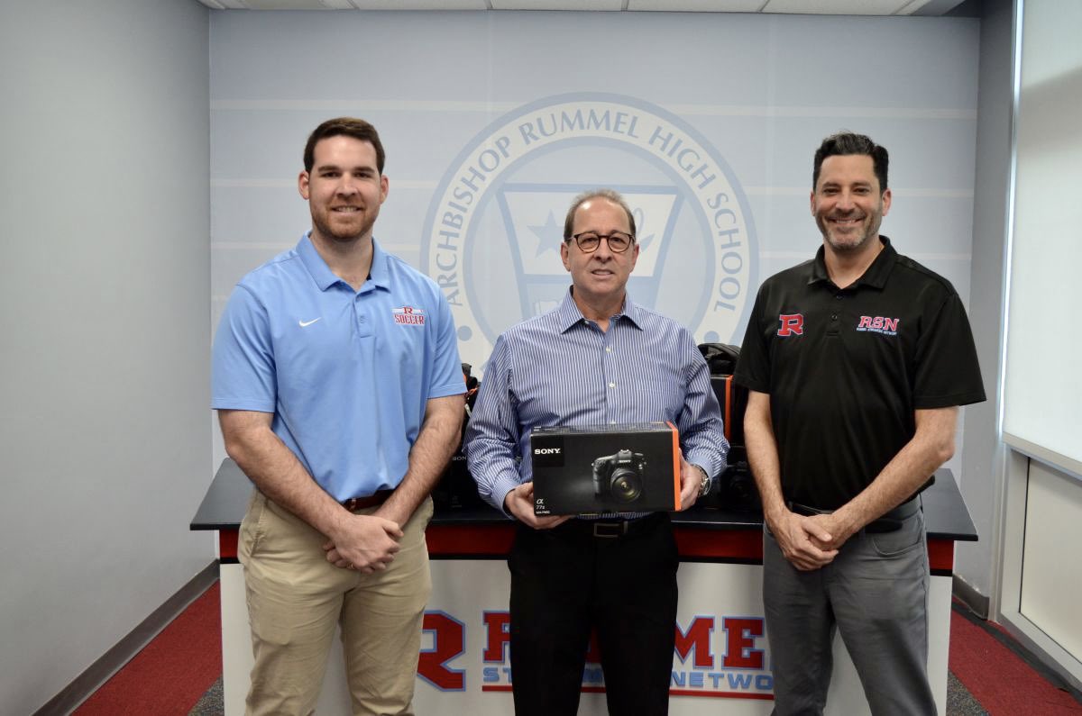 ArchRUMMEL's tweet photo. We had a special guest stop by this week, Rummel Alumnus Michael Hebert ‘78. 

Mr. Hebert, who is the Director of Photography for the New Orleans Saints, made a personal donation of cameras and equipment for our student photographers. 

Thank you, Mr. Hebert! #RummelAlumni https://t.co/5Pugp7Qufn