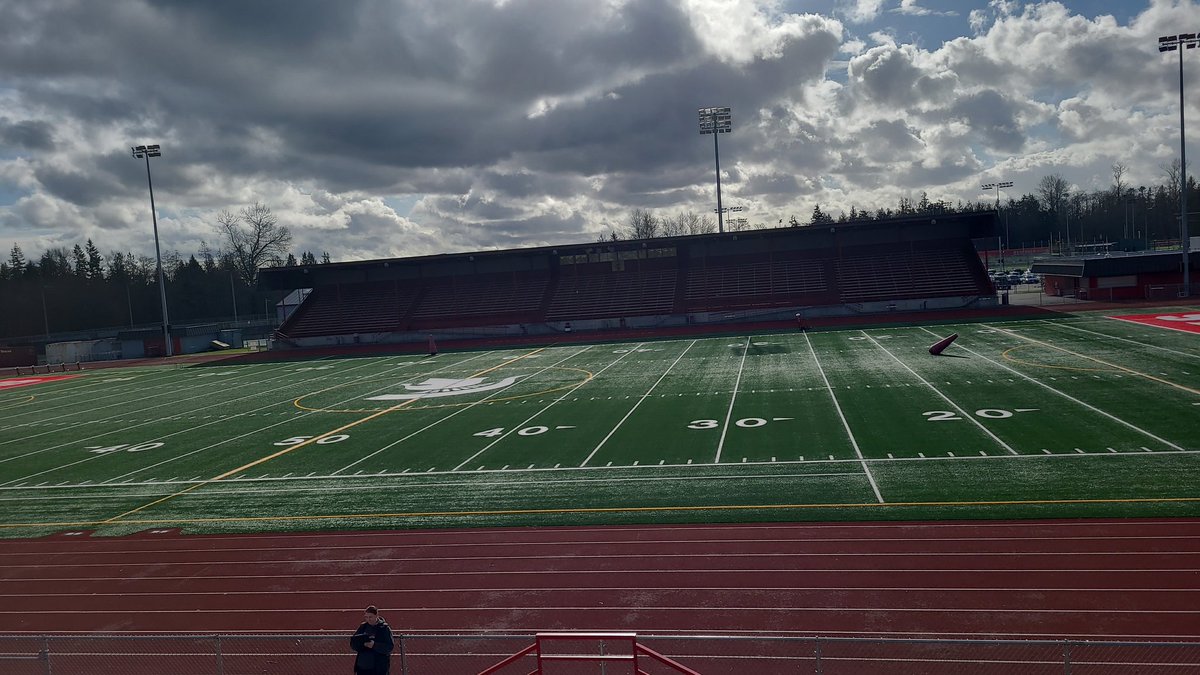 I feel big sitting on the school's bleachers.