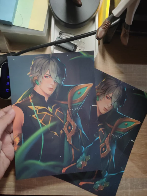 Happy Birthday to Alhaitham No new artworks atm but I'm currently busy with comms and setting up my shopee shop re-launch~ Here's a lil glimpse of my alhaitham work as an art print! He's matte laminated too :> 