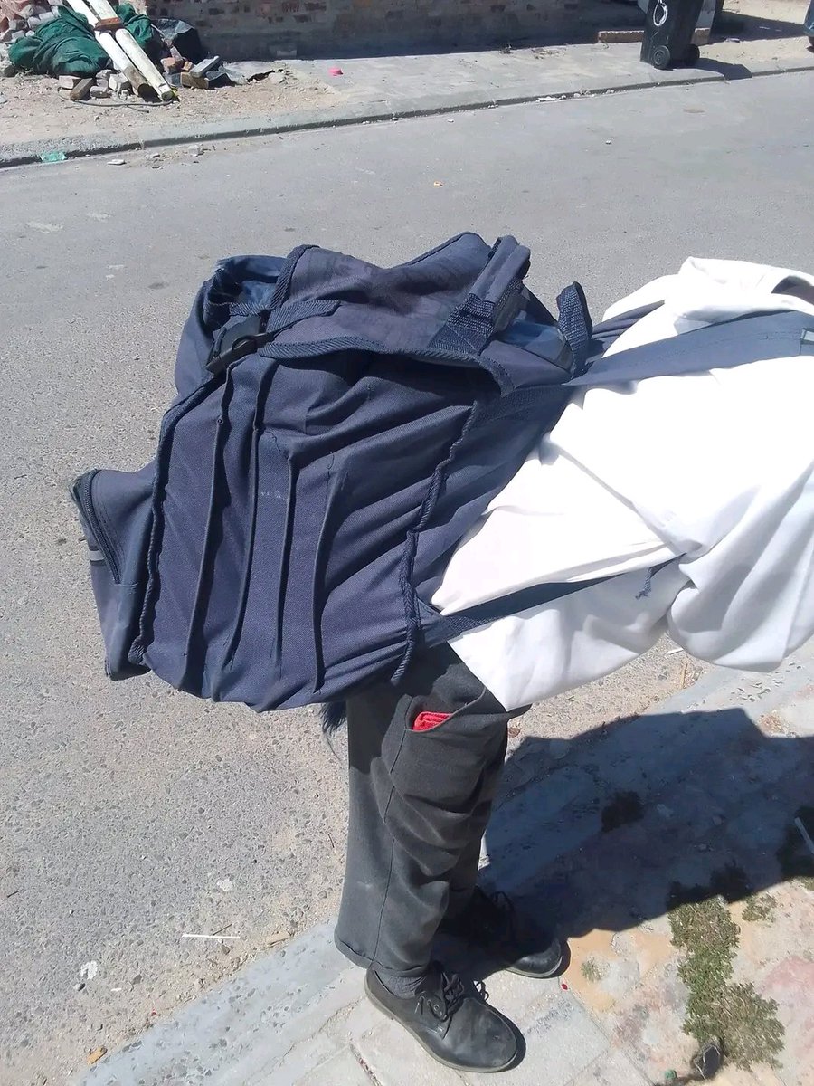 NeRioMacDuana's tweet photo. @DBE_SA @AngieMotshekga #departmentofeducation stop this nonsense of expecting our grade 4 kids to carry these heavy bags as if they are in High skul. You are killing our kids backs. This surgery cost R3m. So sad that our kids are becoming scraps by each day https://t.co/MitrALT3jJ