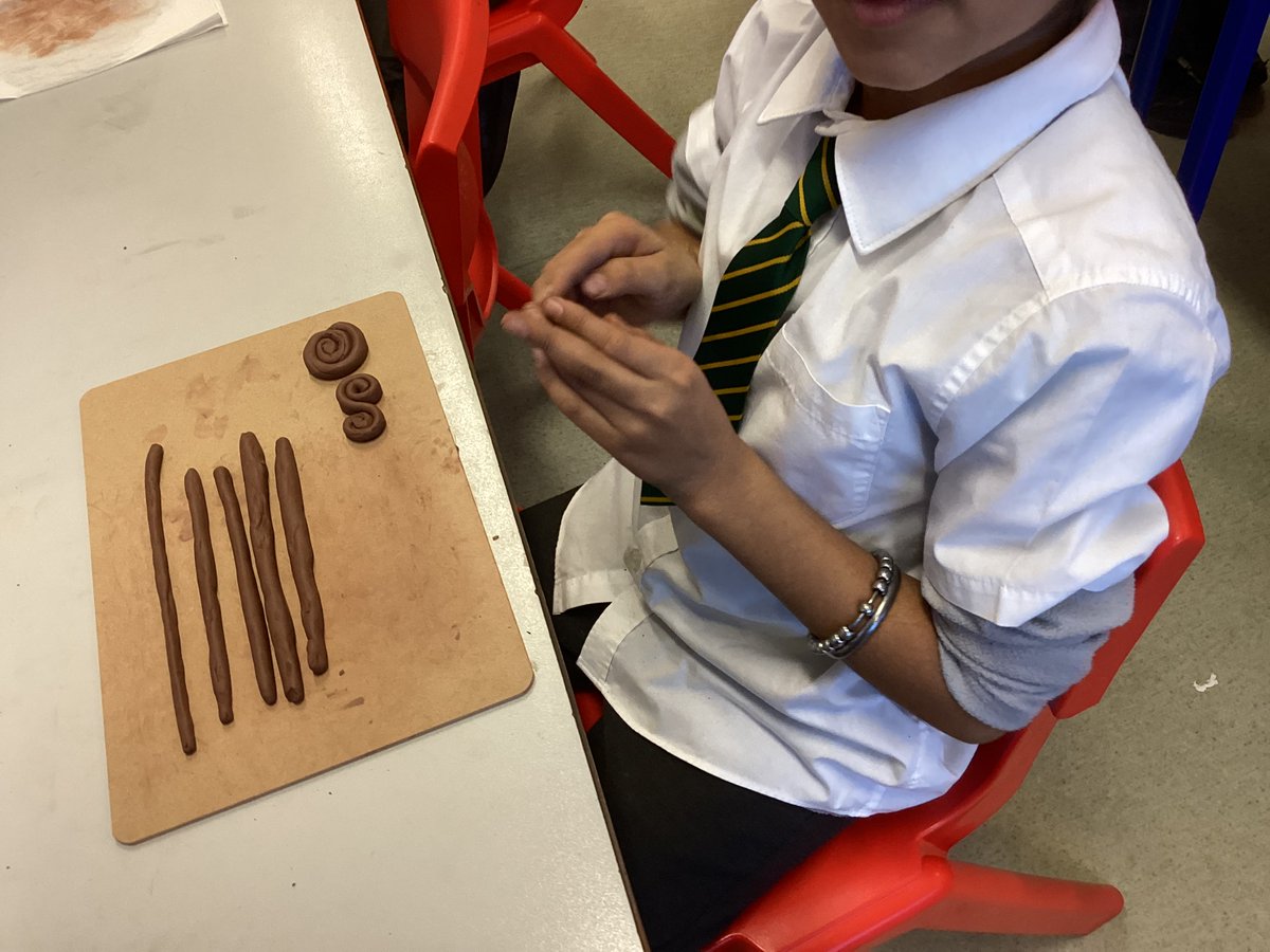GoldthornPark's tweet photo. In Art this week, Class 8 have been experimenting with clay and testing out different coil motifs ready for next week when they will be making their own coil pots. We used the coils from the lesson to make a class pot. What do you think? #AthethsvSparta #Dimensionscurriculum https://t.co/zpBVWlisQB