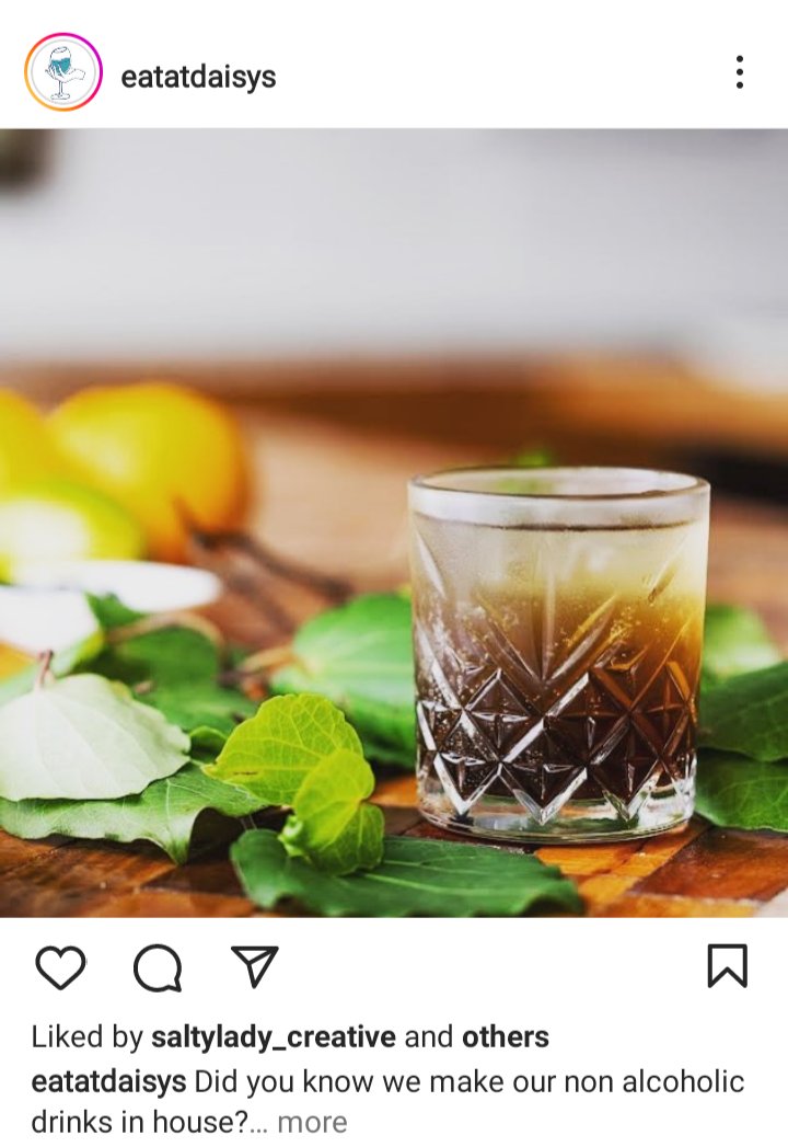 Daisy's Cafe IG. photo of mint, lemon and a brown beverage in a cut crystal tumbler. Caption reads "Did you know we make our non alcoholic drinks in house?" 