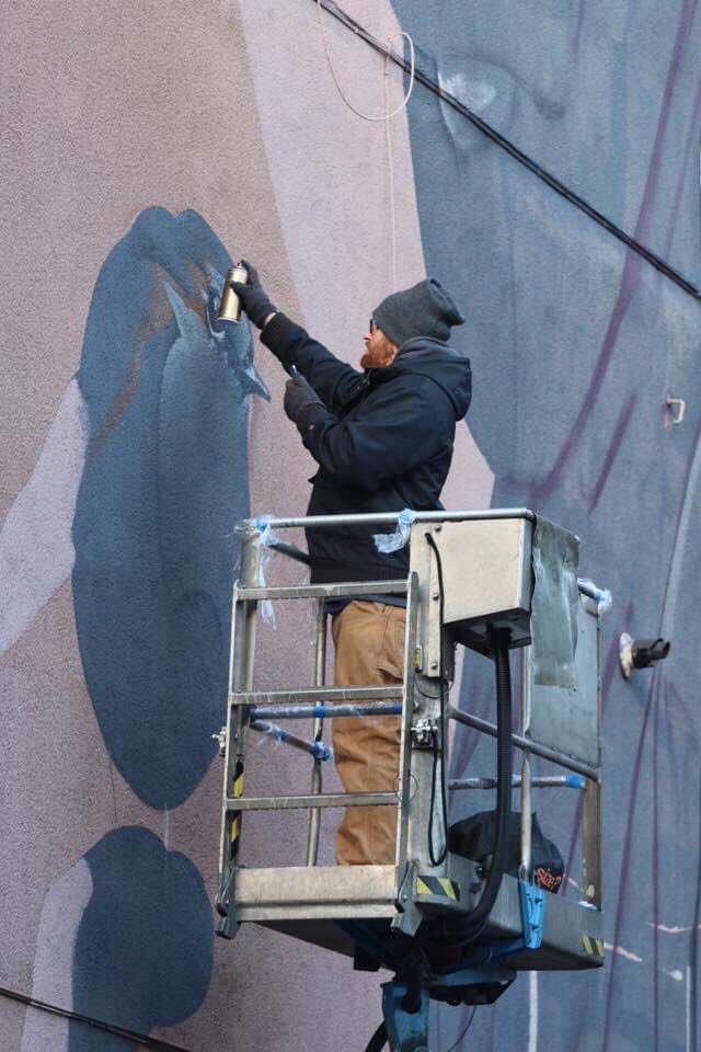 Artist at work in Feb 2016, #Smug working on his St.Mungo mural in High St #LookupinGlasgow #Glasgow #Scotland #GlasgowMural #streetart #artist #art @peoplemakeGLA @WeeBirdGlasgow @Glasgow_Live @LostGlasgow @ScotsMagazine #glasgowart #mural