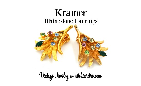 #Kramer #vintage earrings set with #rhinestones at differing heights and on slender gold stems gives them a 3-D #cosmic quality. The lone emerald #green navette is an interesting twist. Interesting #design and quite #unique. #vintagejewelry #bitchinretro bitchinretro.com/products/krame…